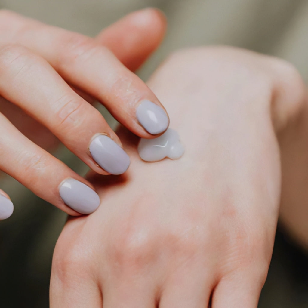 Model applying lightweight mattifying primer for smooth, poreless skin